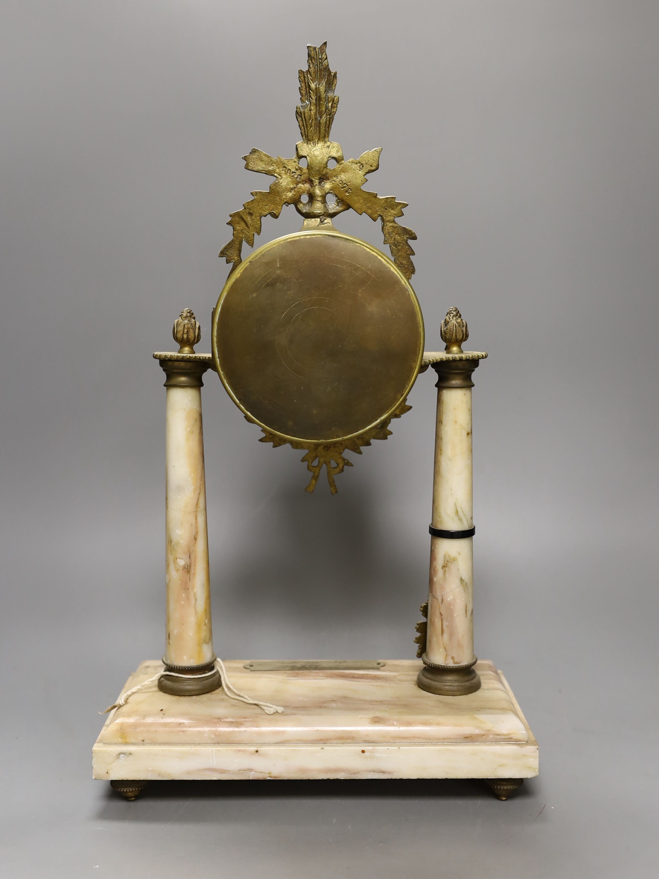 A French three-piece marble and gilt metal clock garniture, pendulum, no winder. 42cm